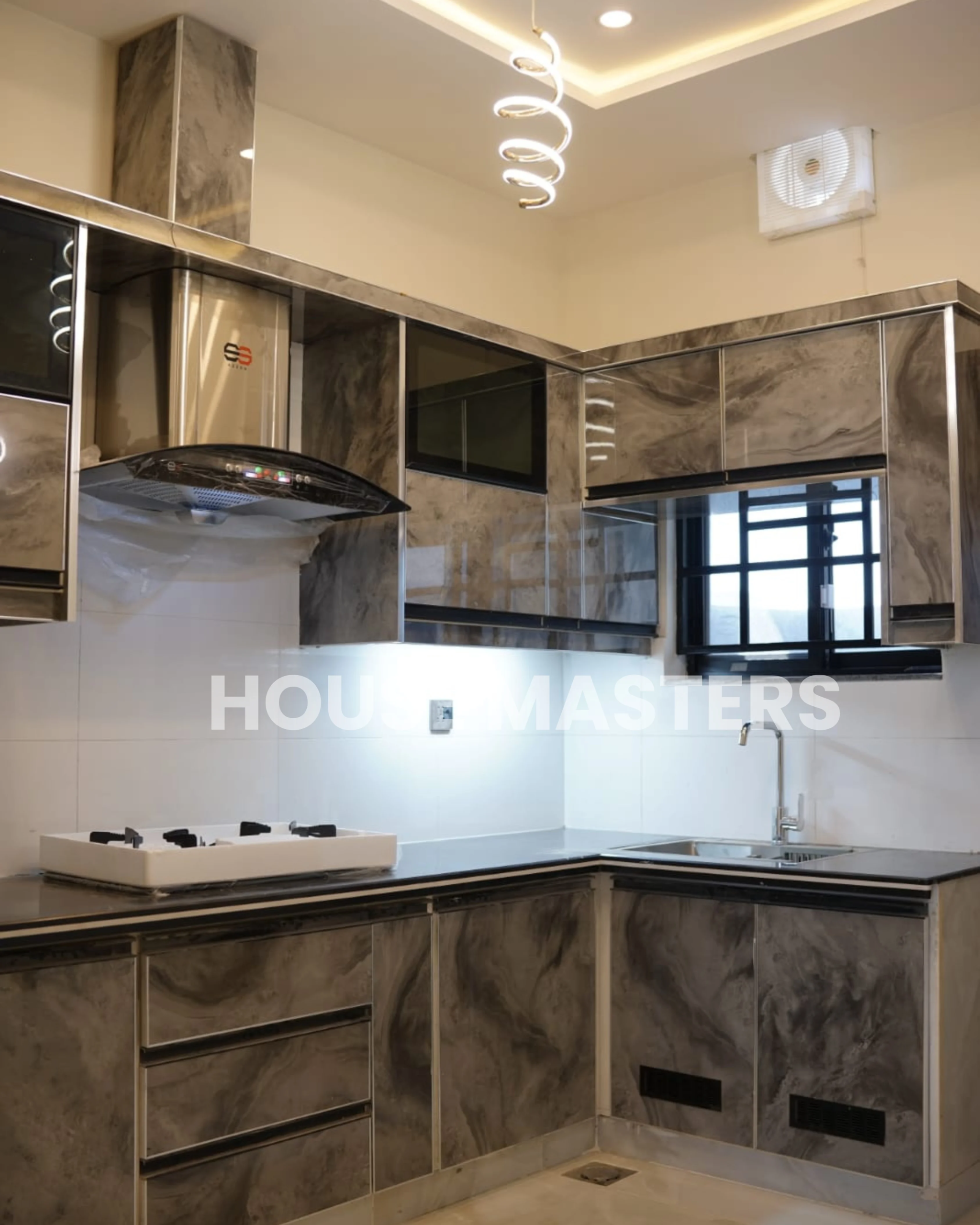 Modern kitchen with premium finishes and sleek appliances in a 5 Marla home