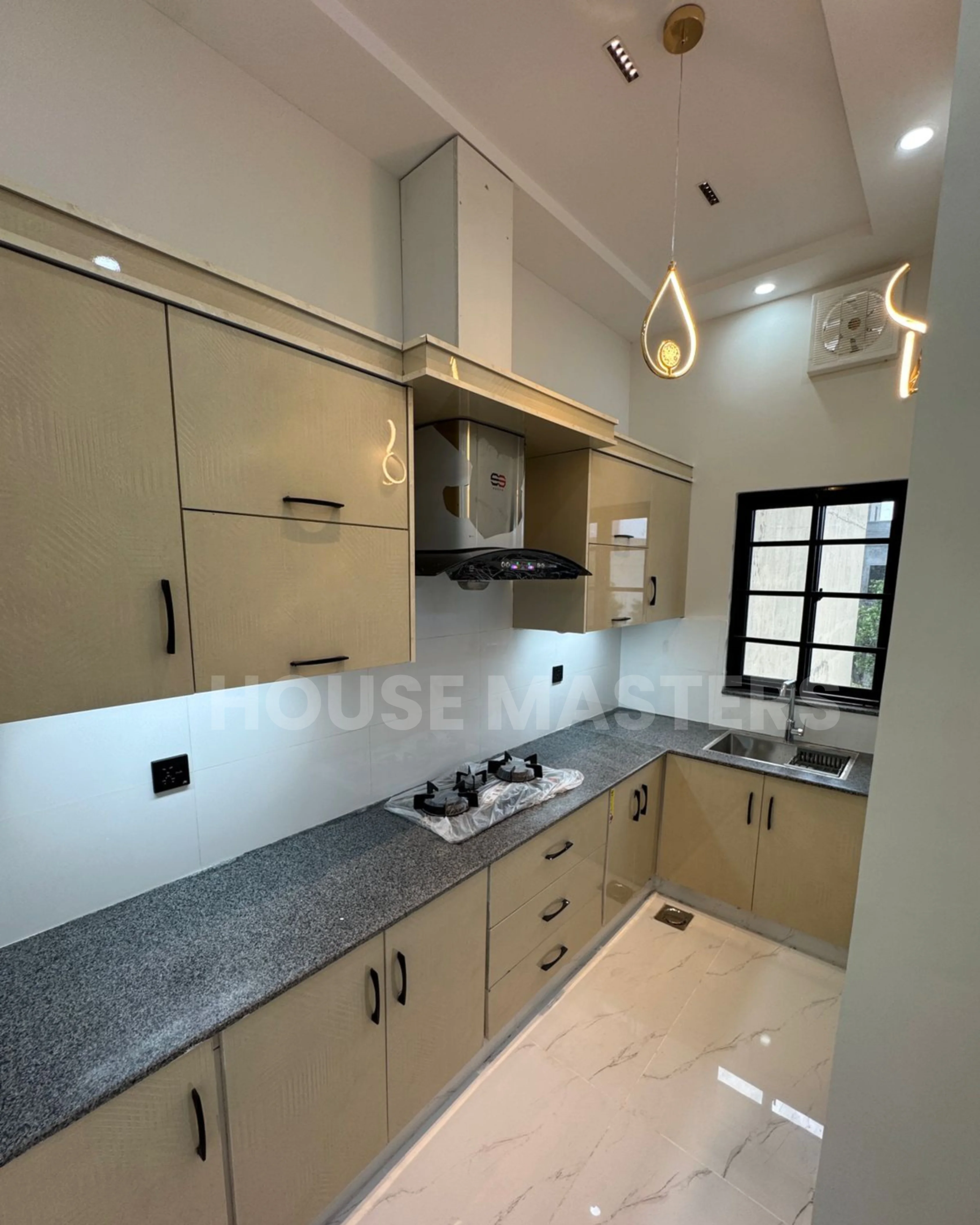 Modern kitchen with premium finishes and sleek appliances in a 5 Marla home