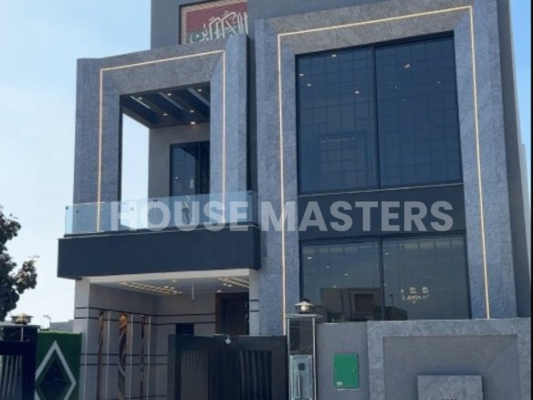Brand new 5 Marla luxury house exterior with modern architecture, large windows, and grey facade in Bahria Orchard, Lahore.