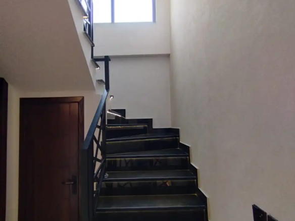 Black marble staircase design with tread lighting in 5 Marla house