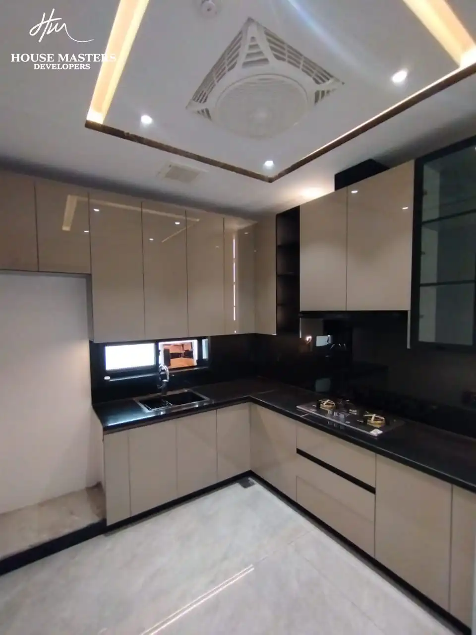 5 Marla Modern House for Sale in DHA Rahber Lahore Modern L-shaped kitchen layout with cabinets in 5 Marla luxury house