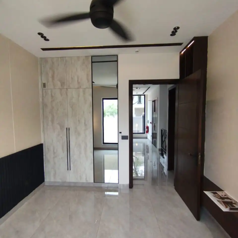 Luxury bedroom interior design with wooden flooring in DHA Rahber house