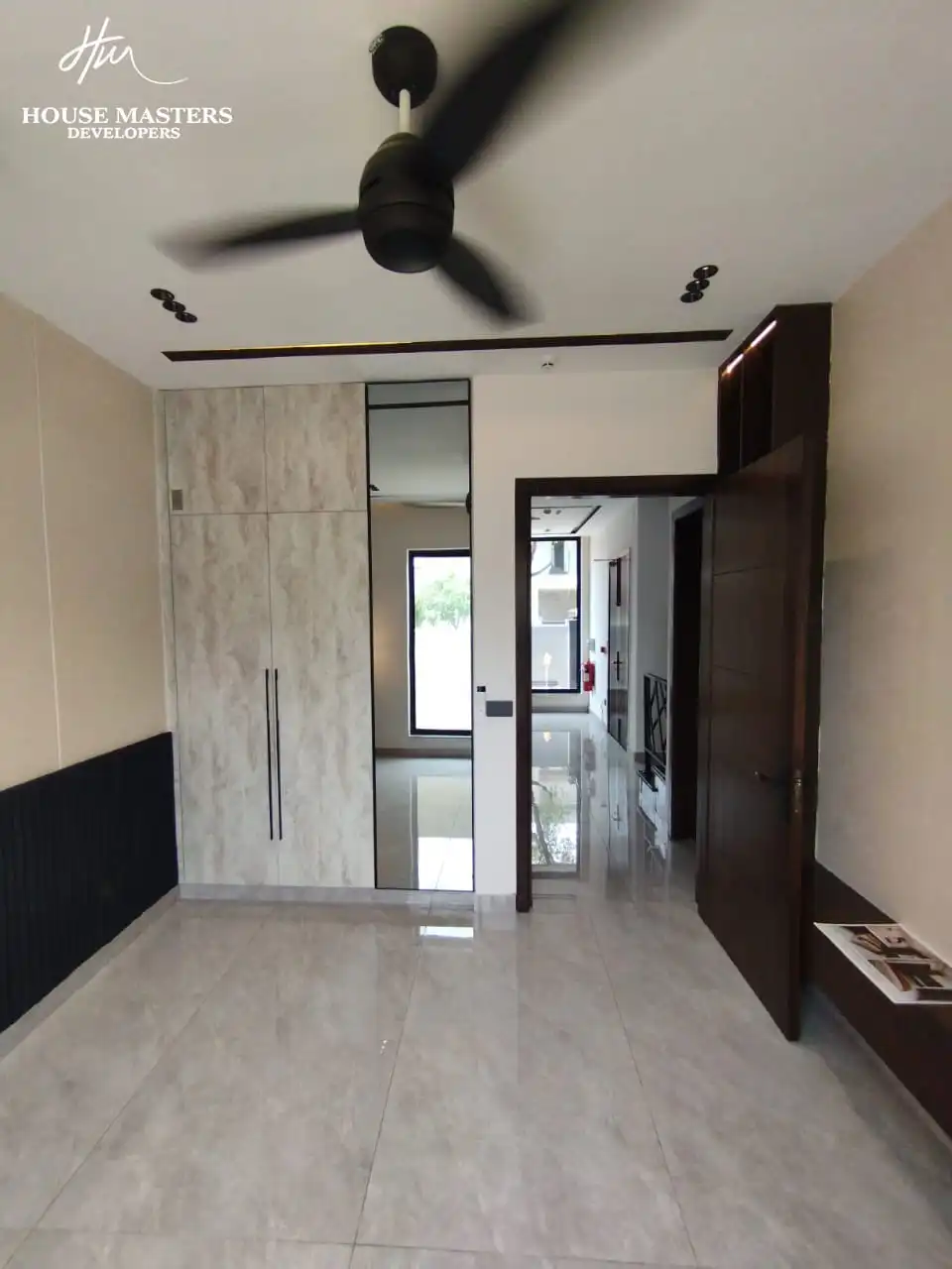 5 Marla Modern House for Sale in DHA Rahber Lahore Luxury bedroom interior design with wooden flooring in DHA Rahber house
