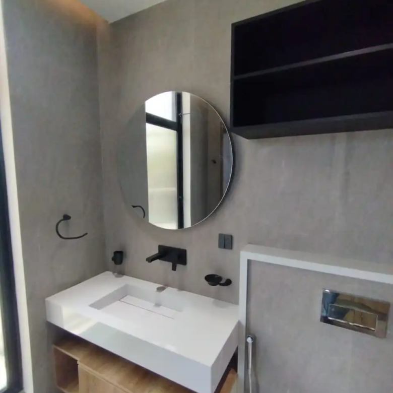 Contemporary bathroom design with gray tiles and floating white vanity