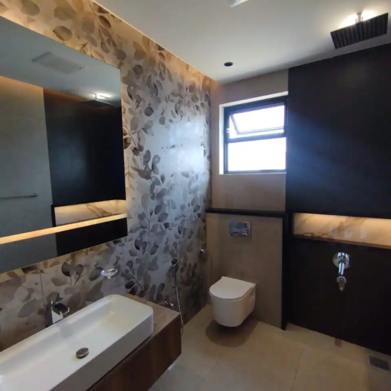 Luxury bathroom with backlit LED round mirror and floral wall tiles