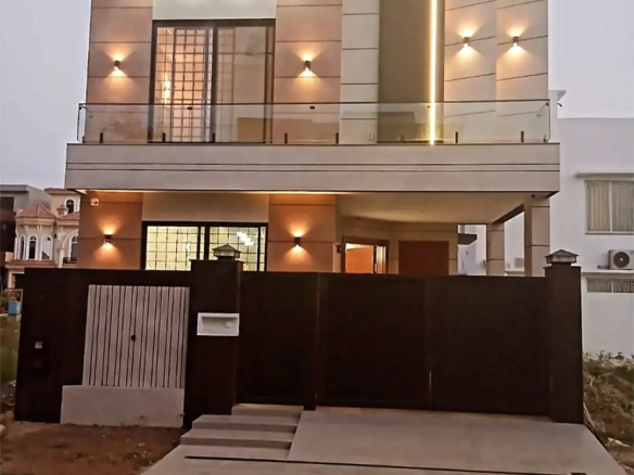 5 Marla double-story house for sale in DHA Rahbar Lahore with 3 bedrooms, attached baths, modern kitchen, TV lounge, drawing room and car parking.