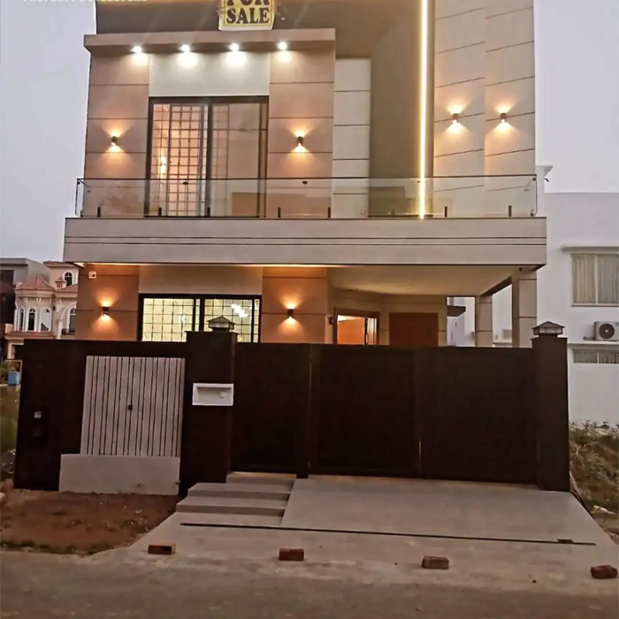 5 Marla double-story house for sale in DHA Rahbar Lahore with 3 bedrooms, attached baths, modern kitchen, TV lounge, drawing room and car parking.