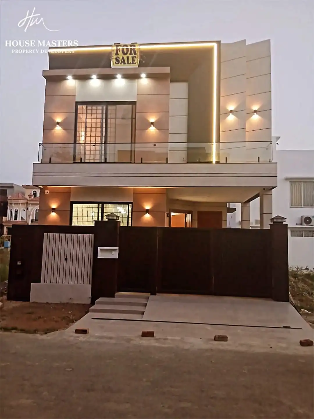 5 Marla double-story house for sale in DHA Rahbar Lahore with 3 bedrooms, attached baths, modern kitchen, TV lounge, drawing room and car parking.
