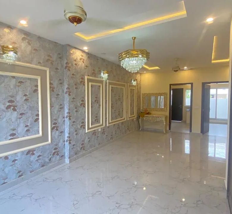 Spacious bedroom with luxury wardrobe and attached bathroom inside 5 Marla house for sale in Lake City Lahore.