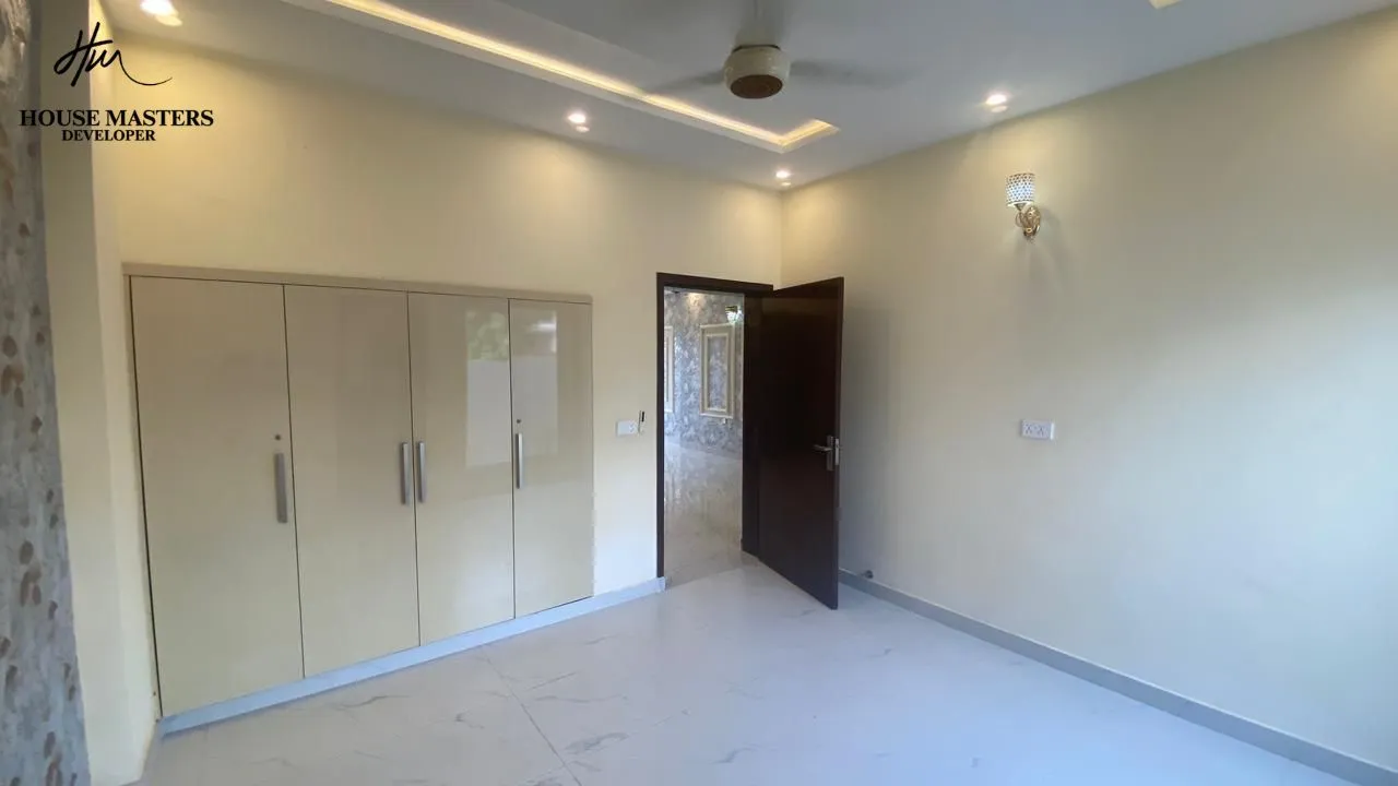 lake city lahore 5 marla bedroom design Spacious bedroom with luxury wardrobe and attached bathroom inside 5 Marla house for sale in Lake City Lahore.
